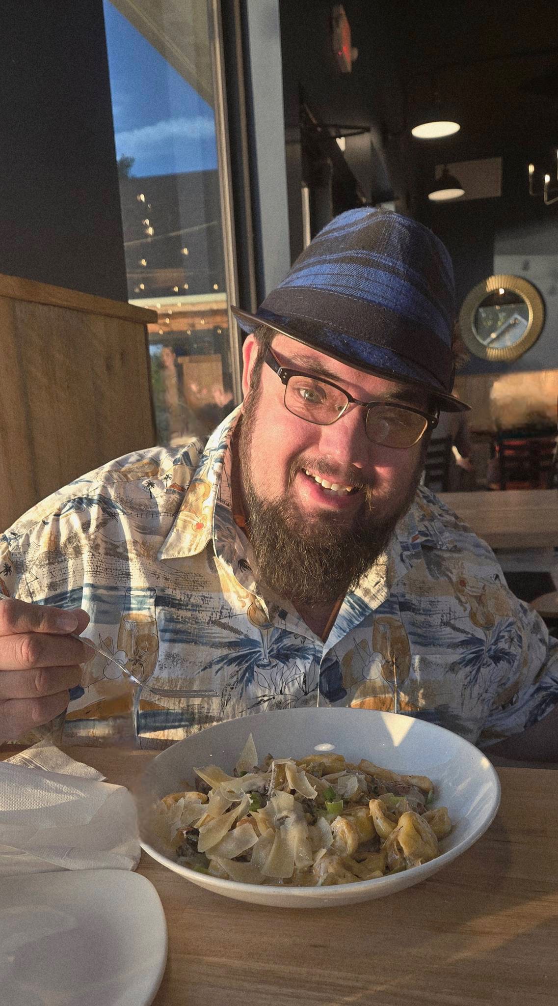 Grady Hughes smiling at dinner, living his best life