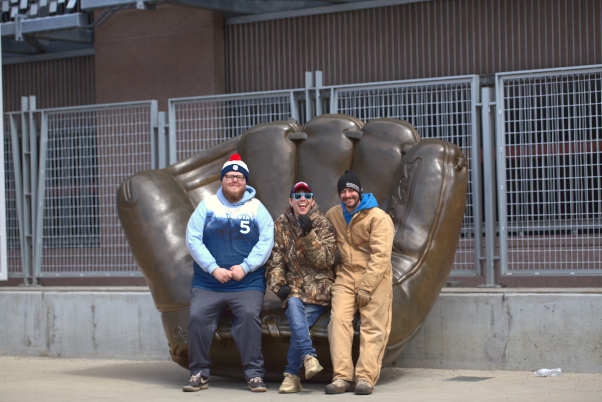 Three friends in the giant baseball glove at Target Field